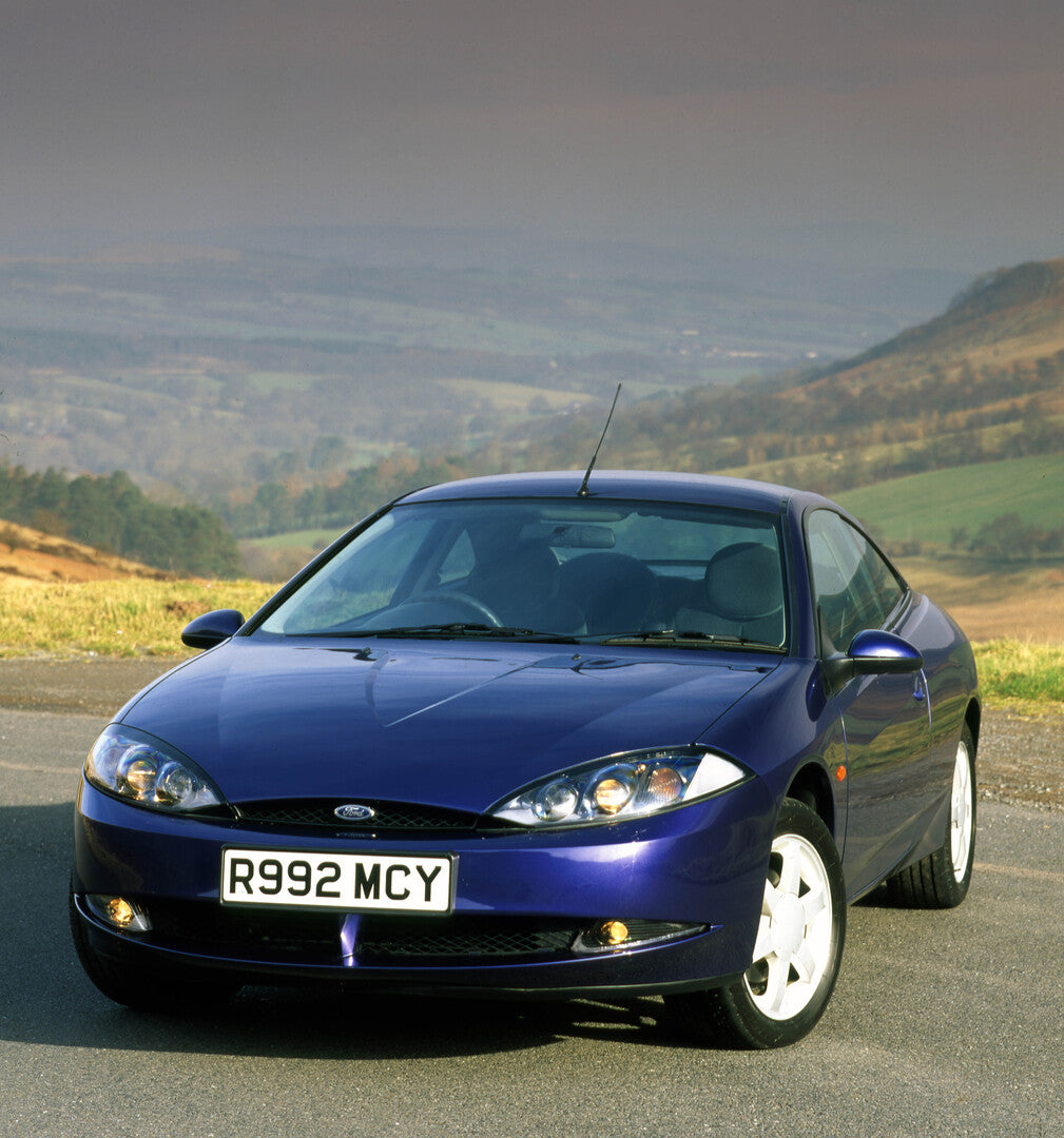 This archival image documents the 1998 Ford Cougar front view on location and is preserved in the Ford Heritage Vault as part of Ford Motor Company's historic photographic archive. Free for personal, non-commercial use. Ford Heritage Vault referen...