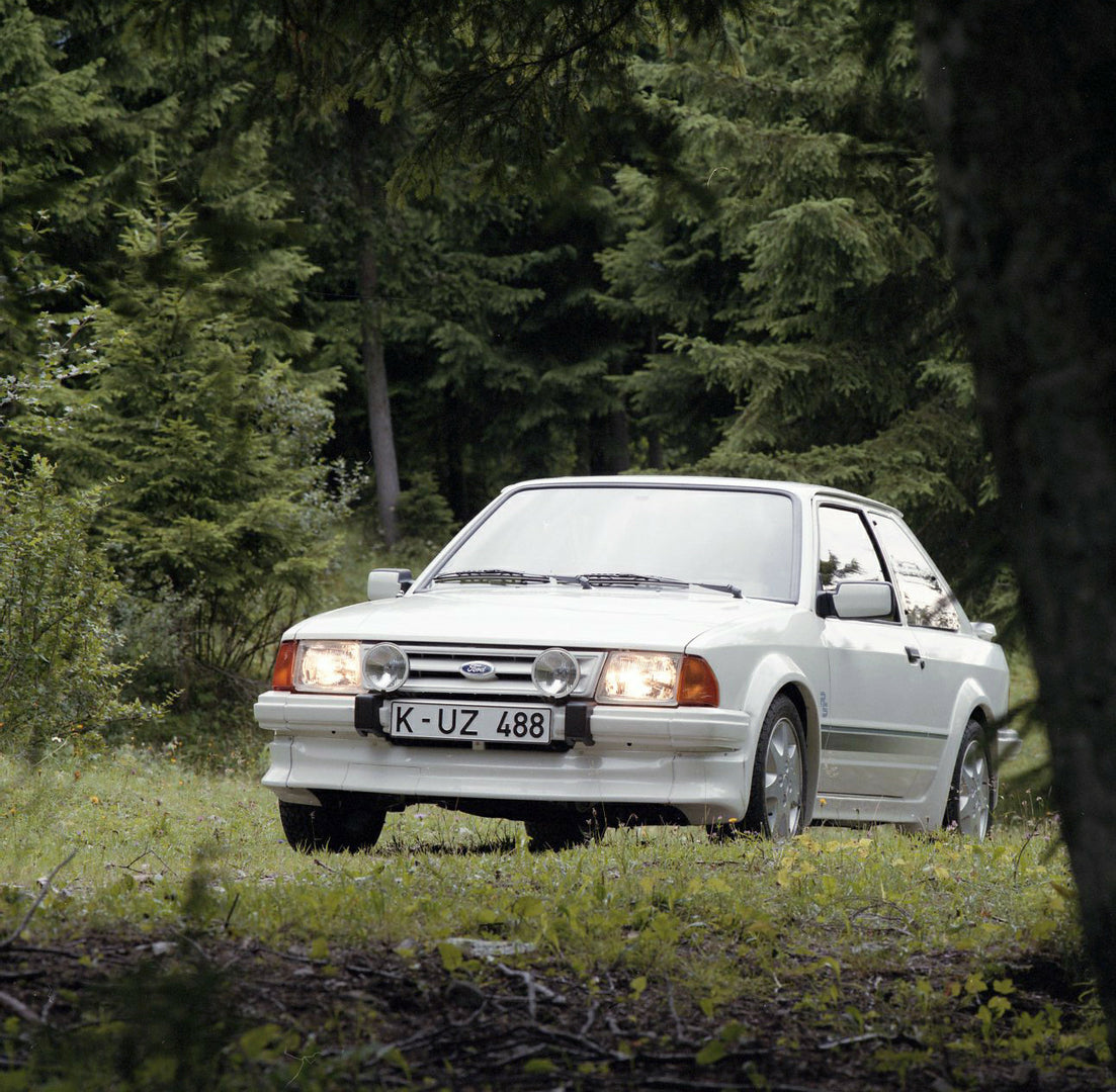 This archival image documents the 1984 Ford Escort Mark III LHD RS Turbo in scenic forest in Munich and is preserved in the Ford Heritage Vault as part of Ford Motor Company's historic photographic archive. Free for personal, non-commercial use. F...