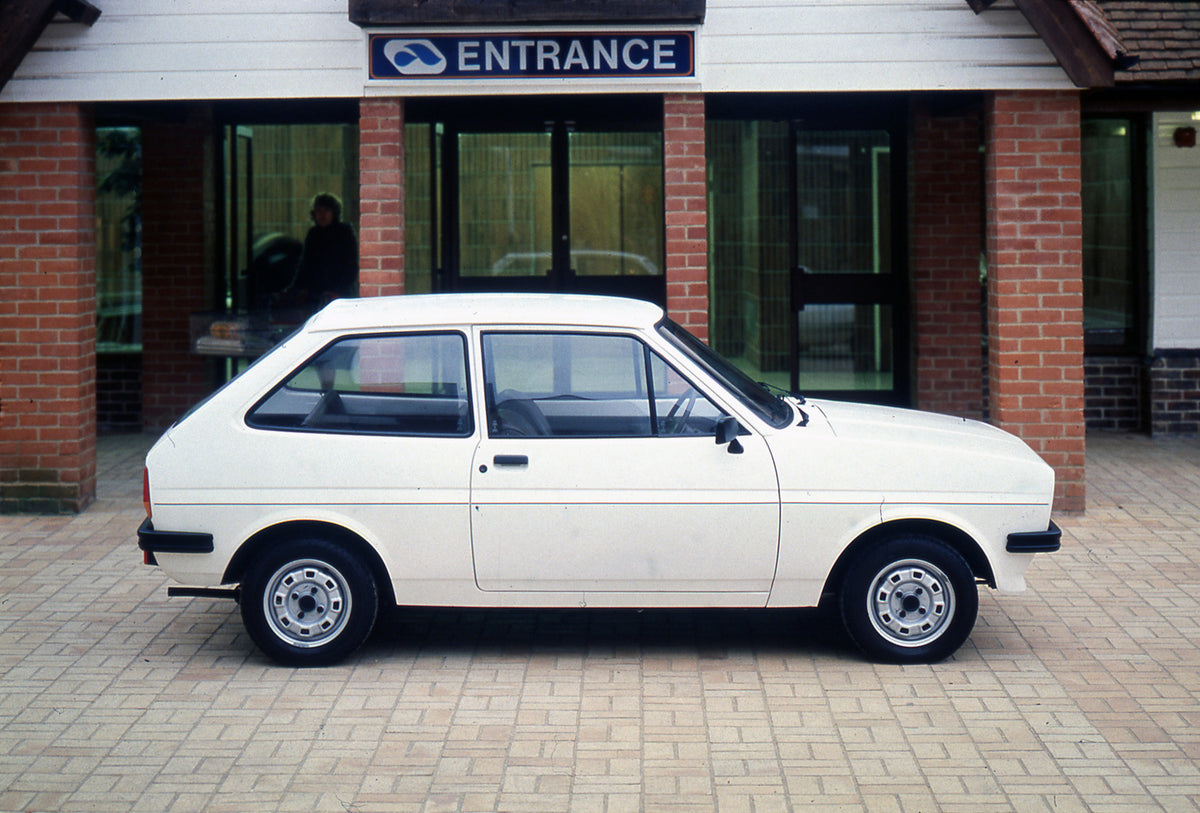 This archival image documents the 1981 Ford Fiesta Mark I Popular side view in front of building and is preserved in the Ford Heritage Vault as part of Ford Motor Company's historic photographic archive. Free for personal, non-commercial use. Ford...