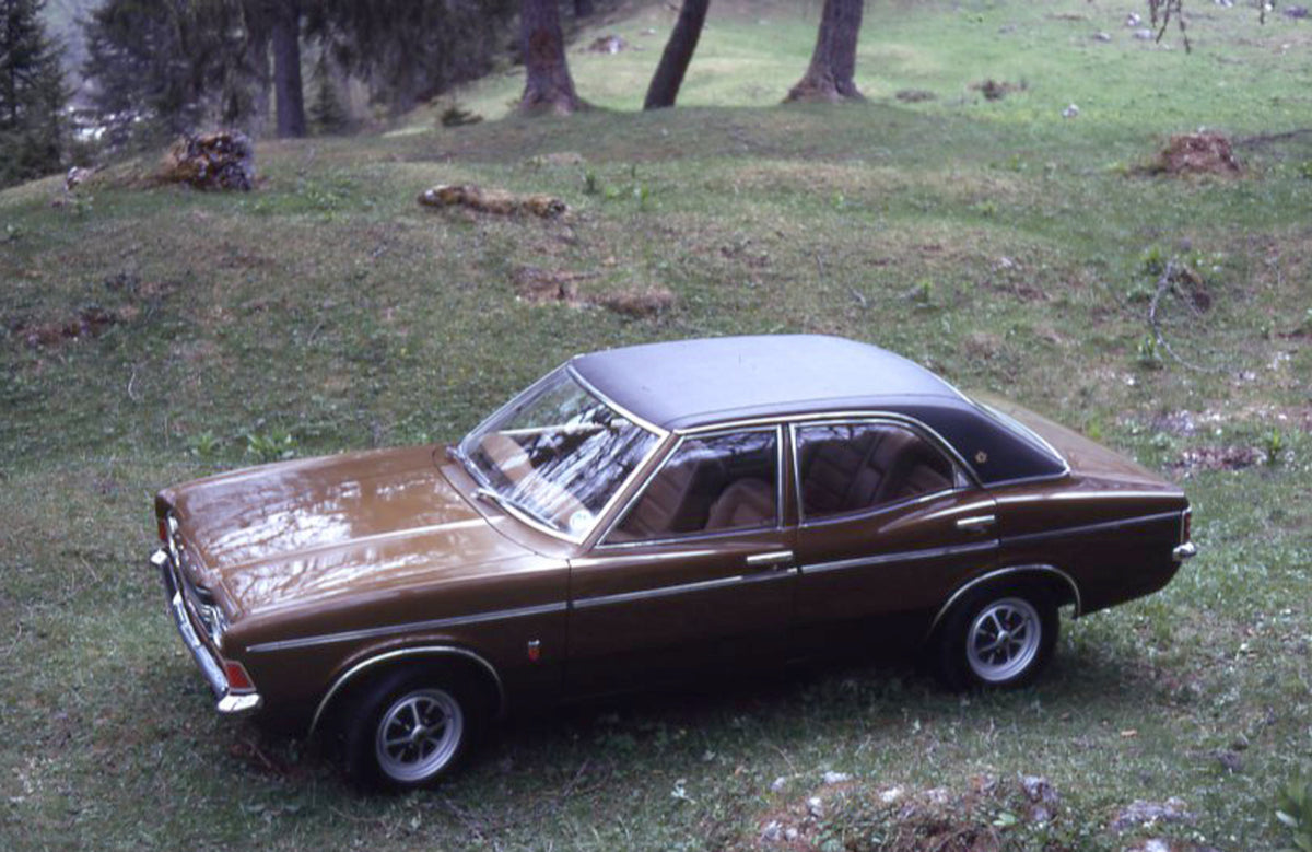 This archival image documents the 1971 Ford Cortina MK III GXL in scenic field and is preserved in the Ford Heritage Vault as part of Ford Motor Company's historic photographic archive. Free for personal, non-commercial use. Ford Heritage Vault re...