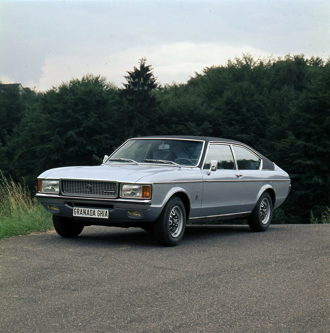 This archival image documents the 1974 Ford Granada Mark I on scenic road with trees and is preserved in the Ford Heritage Vault as part of Ford Motor Company's historic photographic archive. Free for personal, non-commercial use. Ford Heritage Va...