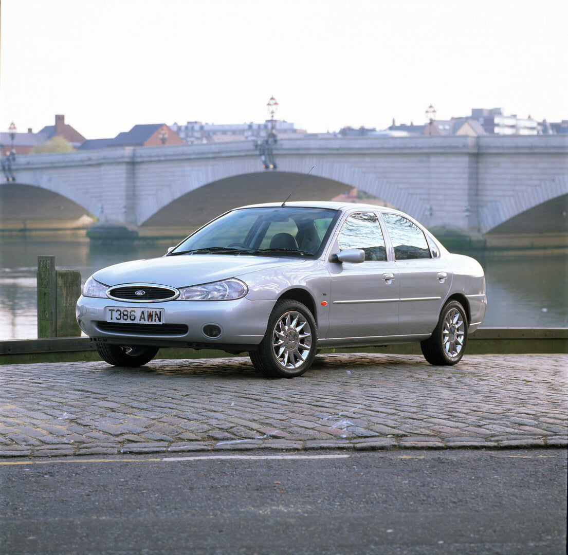This archival image documents the 1999 Ford Mondeo V6 in front of bridge 1999-117 and is preserved in the Ford Heritage Vault as part of Ford Motor Company's historic photographic archive. Free for personal, non-commercial use. Ford Heritage Vault...