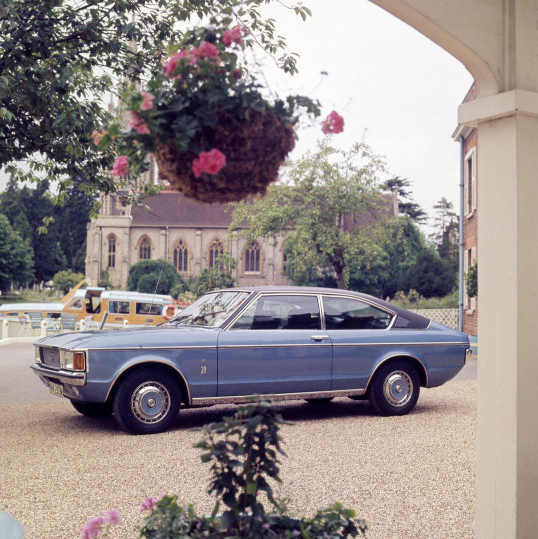 This archival image documents the 1977 Ford Granada Mark I with scenic church and flowers and is preserved in the Ford Heritage Vault as part of Ford Motor Company's historic photographic archive. Free for personal, non-commercial use. Ford Herita...