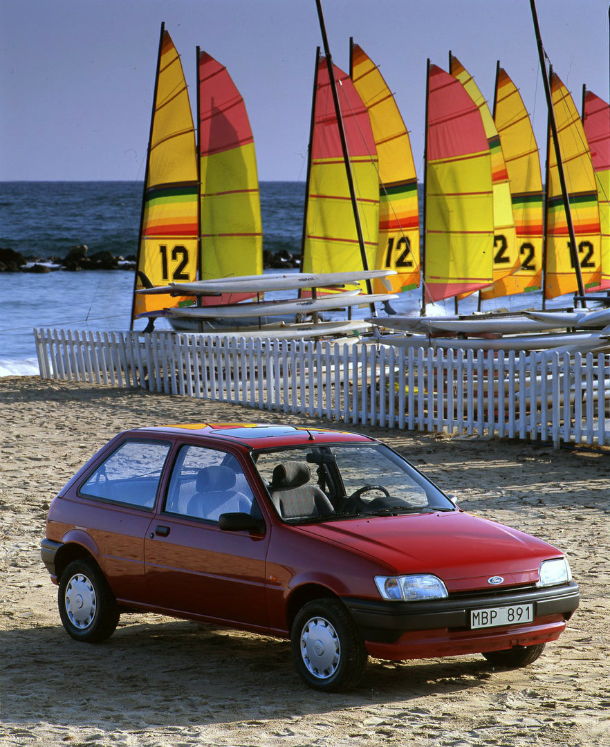 This archival image documents the 1994 1/2 Ford Fiesta Mark III on scenic beach with boat in Cannes and is preserved in the Ford Heritage Vault as part of Ford Motor Company's historic photographic archive. Free for personal, non-commercial use. F...