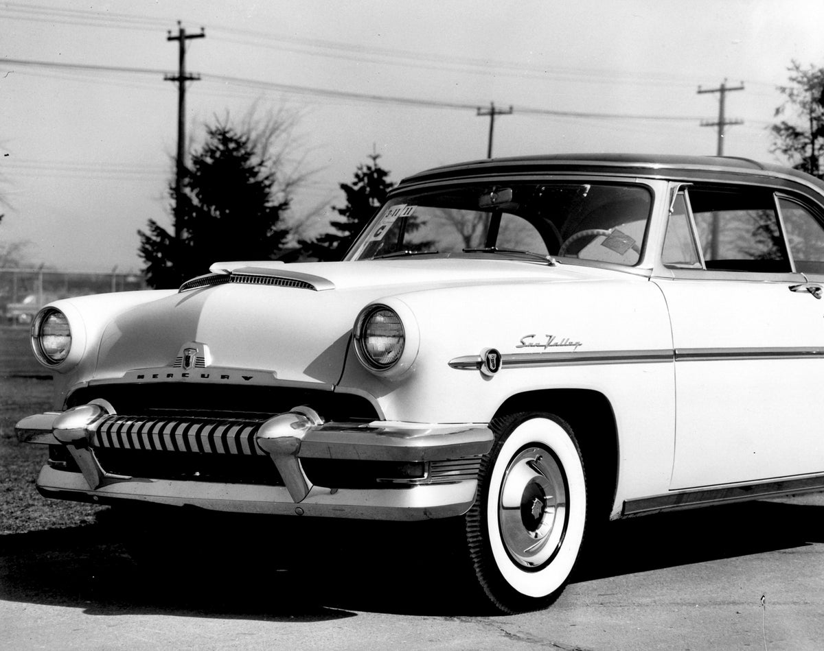 This archival image documents the 1954 Monarch Sun Valley Coupe front closeup in scenic road with trees AR-2007-5 and is preserved in the Ford Heritage Vault as part of Ford Motor Company's historic photographic archive. Free for personal, non-com...