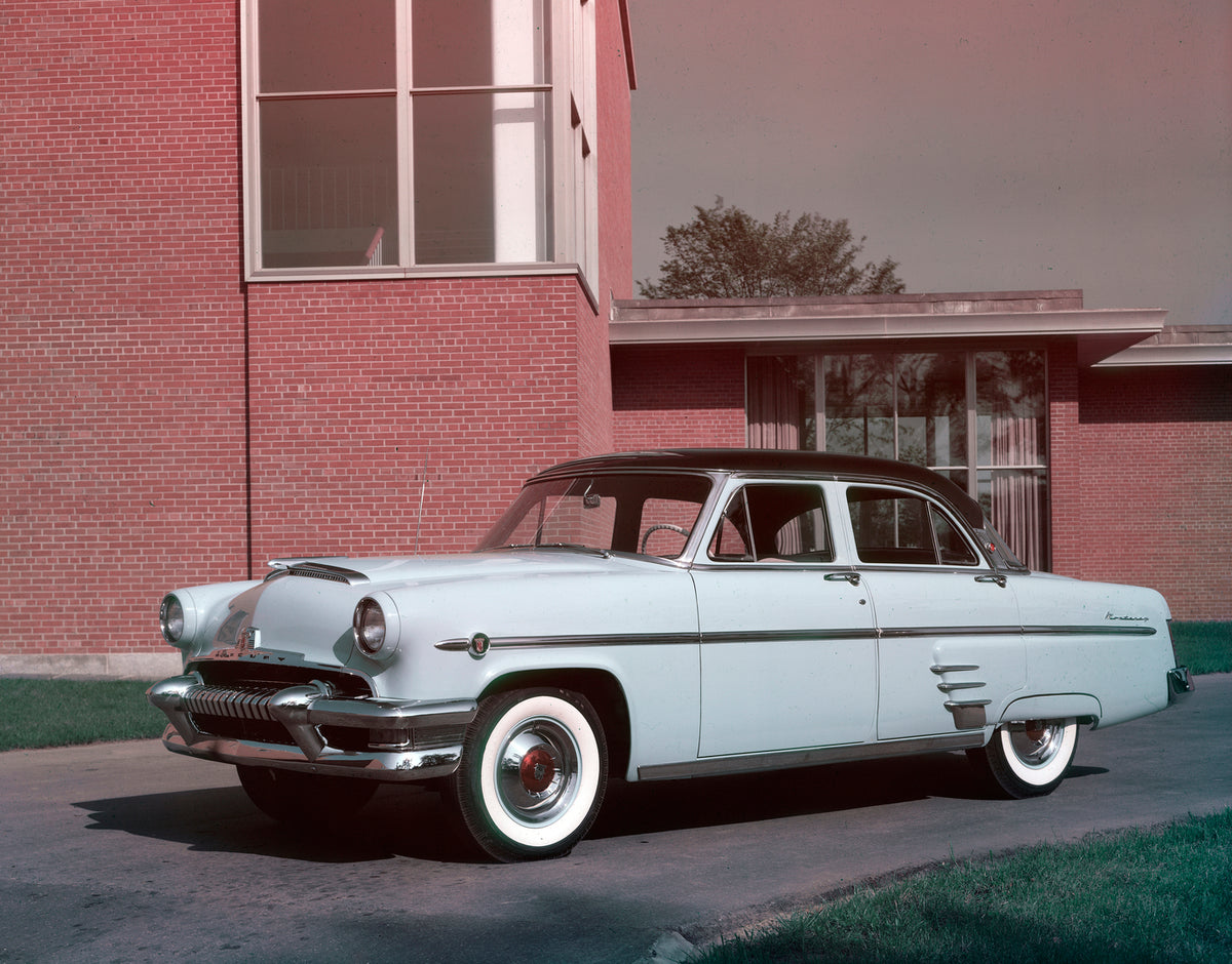 This archival image documents the 1954 Mercury Monterey four-door sedan in Front of a Building and is preserved in the Ford Heritage Vault as part of Ford Motor Company's historic photographic archive. Free for personal, non-commercial use. Ford H...