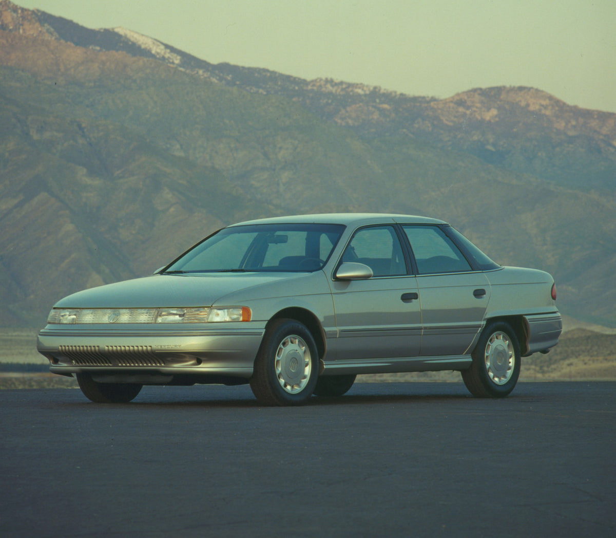 This archival image documents the 1992 Mercury Sable rear angle in front of building CN63014-34 and is preserved in the Ford Heritage Vault as part of Ford Motor Company's historic photographic archive. Free for personal, non-commercial use. Ford ...