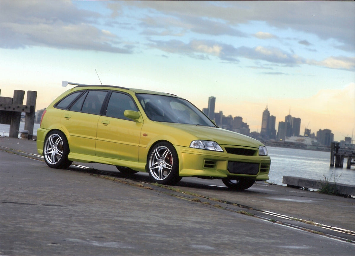 This archival image documents the 2001 Ford Laser RSR on scenic dock with cityscape and is preserved in the Ford Heritage Vault as part of Ford Motor Company's historic photographic archive. Free for personal, non-commercial use. Ford Heritage Vau...