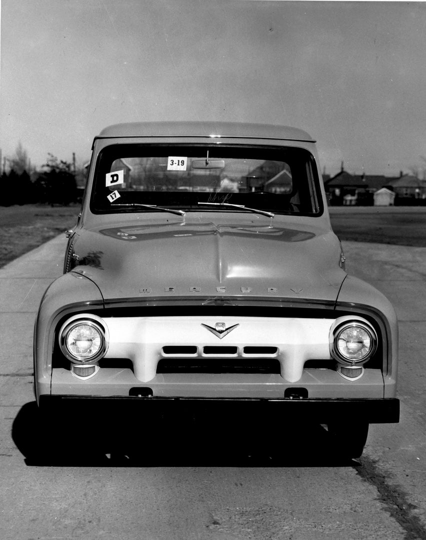 This archival image documents the 1954 Mercury M-100 Pickup front view on road AR-2007-5 and is preserved in the Ford Heritage Vault as part of Ford Motor Company's historic photographic archive. Free for personal, non-commercial use. Ford Heritag...