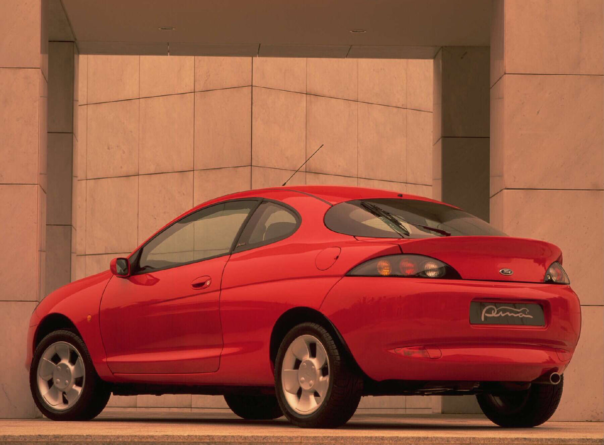 This archival image documents the 1997 Ford Puma rear view with scenic wall AR-2002-213709 and is preserved in the Ford Heritage Vault as part of Ford Motor Company's historic photographic archive. Free for personal, non-commercial use. Ford Herit...