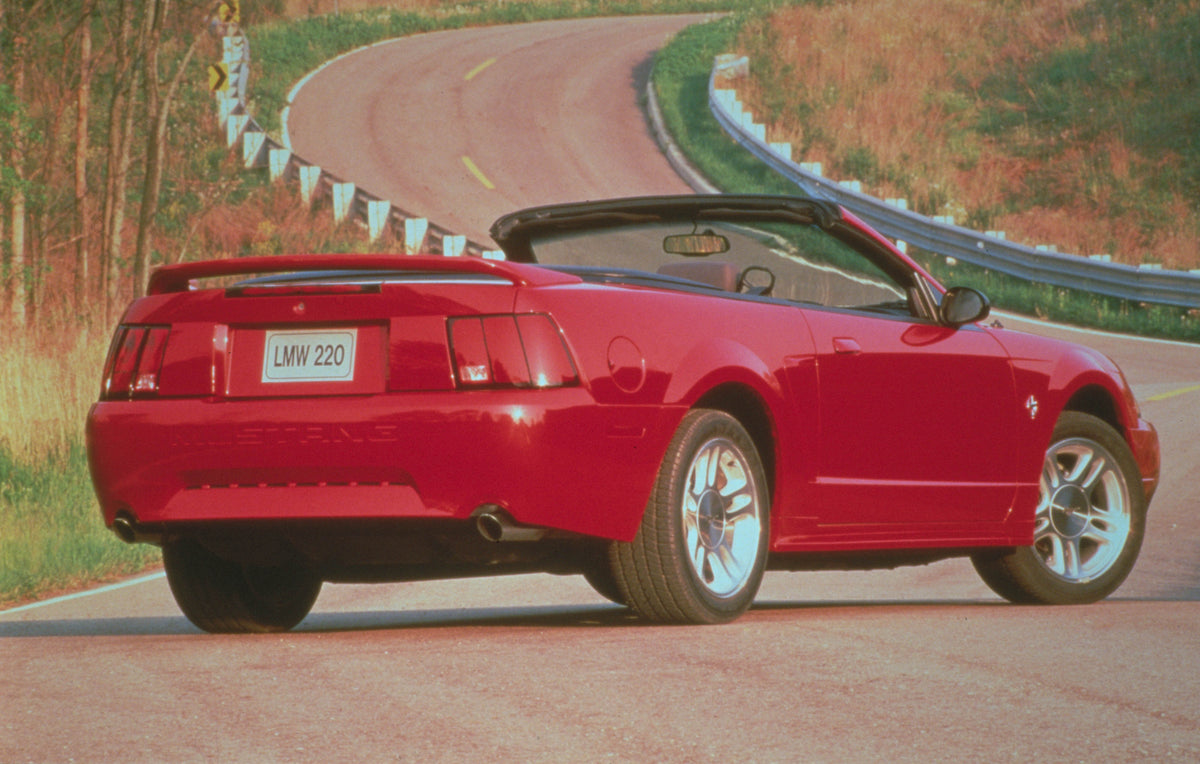 This archival image documents the 2000 Ford Mustang rear view on scenic road MS5888 and is preserved in the Ford Heritage Vault as part of Ford Motor Company's historic photographic archive. Free for personal, non-commercial use. Ford Heritage Vau...