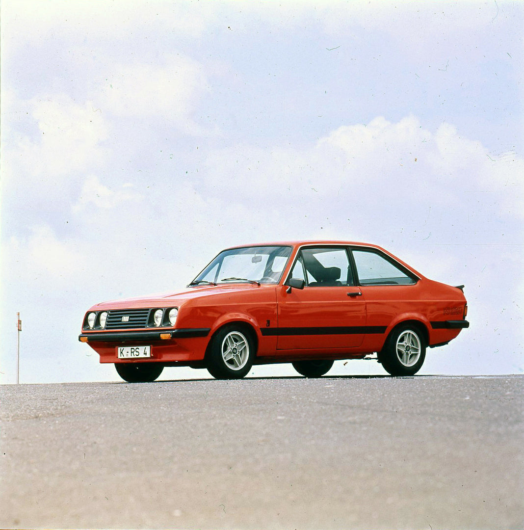 This archival image documents the 1975 Ford Escort Mark II RS 2000 with scenic sky and is preserved in the Ford Heritage Vault as part of Ford Motor Company's historic photographic archive. Free for personal, non-commercial use. Ford Heritage Vaul...