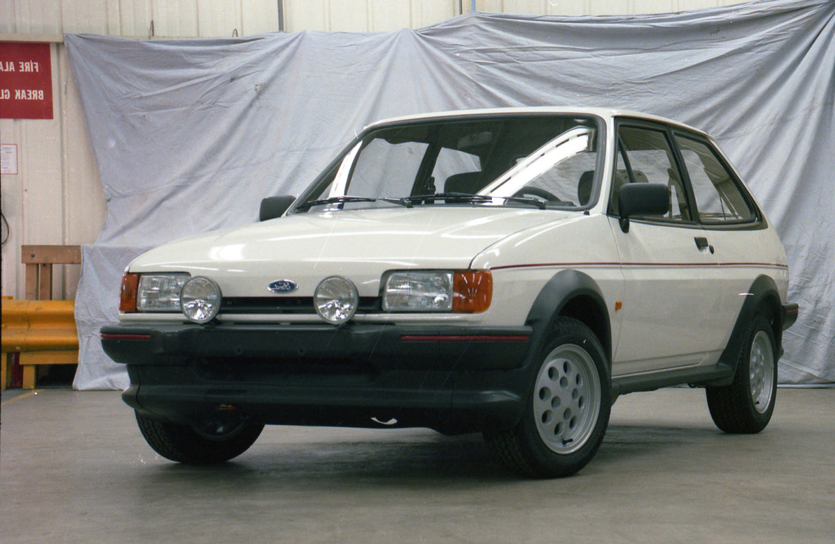 This archival image documents the 1986 Ford Fiesta Mark II XR2 in garage and is preserved in the Ford Heritage Vault as part of Ford Motor Company's historic photographic archive. Free for personal, non-commercial use. Ford Heritage Vault referenc...