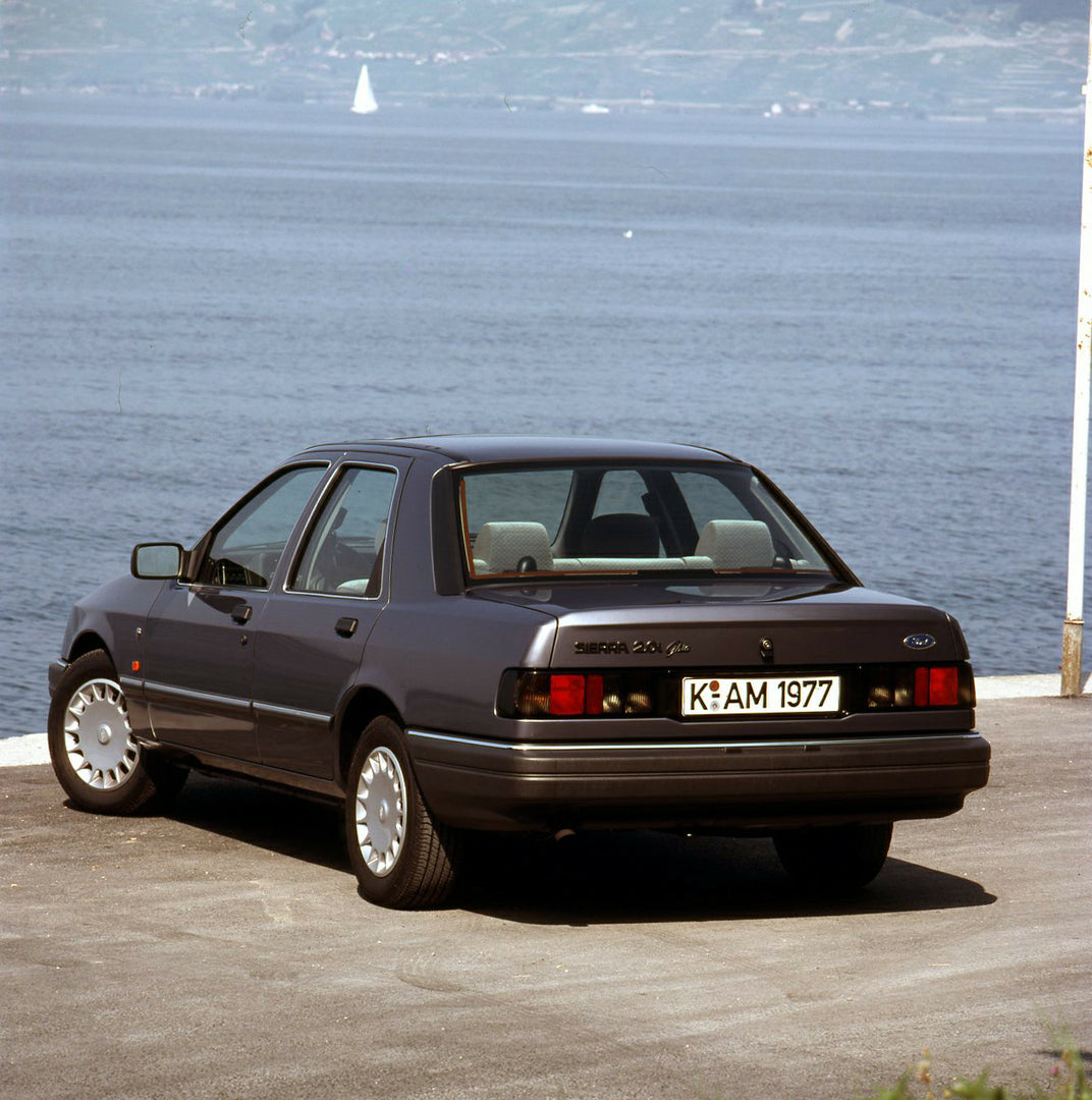 This archival image documents the 1989 Ford Sierra 2.0i Ghia rear view near scnic body of water and is preserved in the Ford Heritage Vault as part of Ford Motor Company's historic photographic archive. Free for personal, non-commercial use. Ford ...