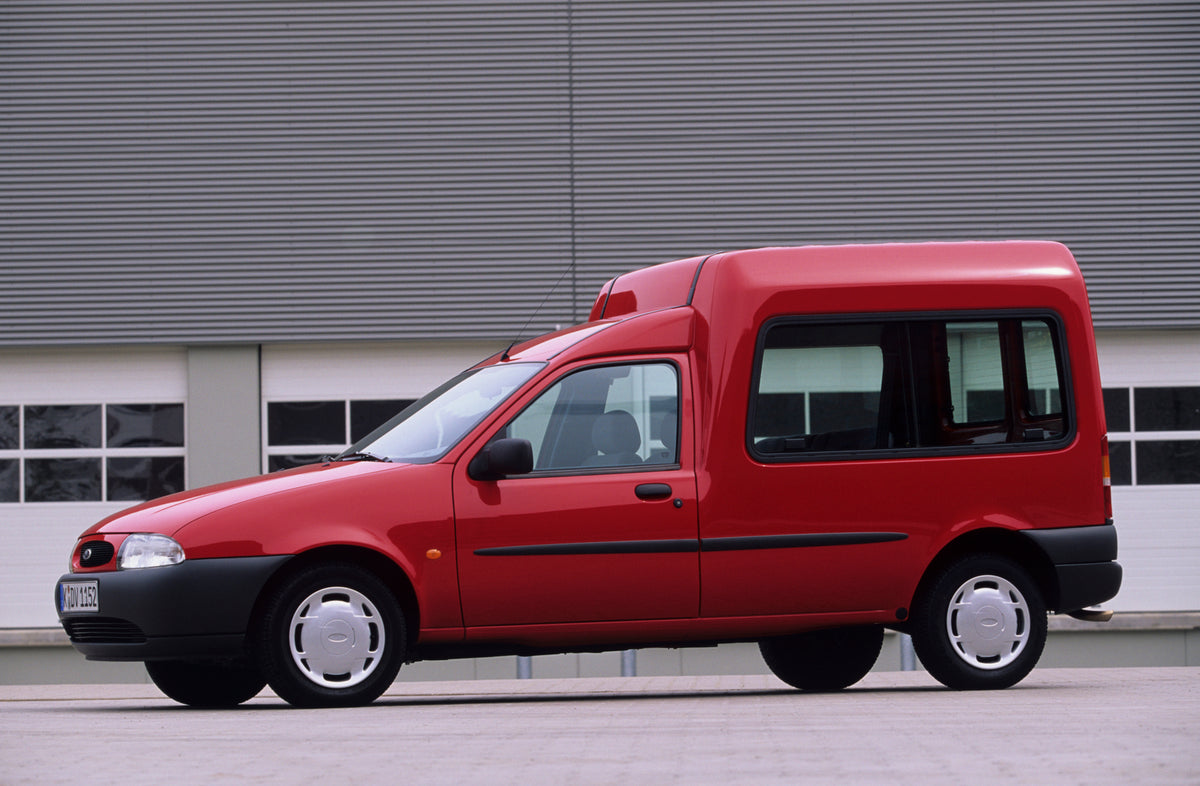 This archival image documents the 1998 Heritage Archive - 1996 Ford Fiesta Mark IV Van side view in front of building and is preserved in the Ford Heritage Vault as part of Ford Motor Company's historic photographic archive. Free for personal, non...