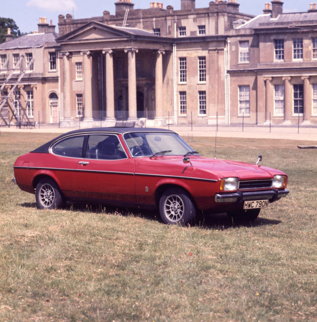 This archival image documents the 1975 Ford Capri II Ghia 2000 in front of scenic building and is preserved in the Ford Heritage Vault as part of Ford Motor Company's historic photographic archive. Free for personal, non-commercial use. Ford Herit...