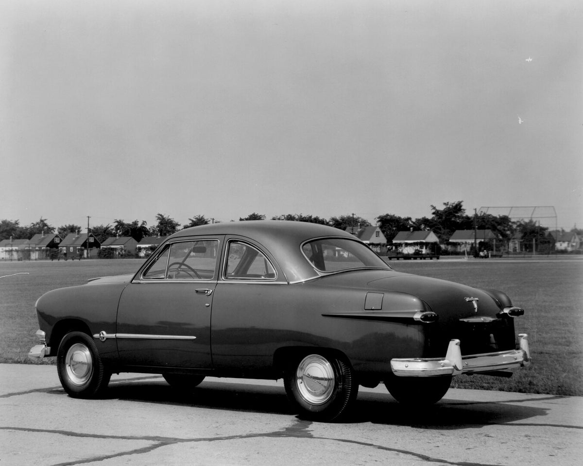 This archival image documents the 1951 Meteor Coupe rear view on road with houses in distance AR-2007-5 and is preserved in the Ford Heritage Vault as part of Ford Motor Company's historic photographic archive. Free for personal, non-commercial us...