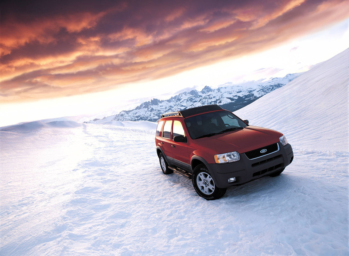 This archival image documents the 2004 Ford Escape in snow and is preserved in the Ford Heritage Vault as part of Ford Motor Company's historic photographic archive. Free for personal, non-commercial use. Ford Heritage Vault reference AR-2008-8.1....