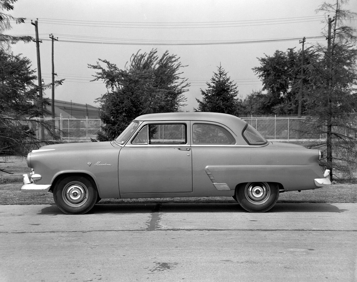This archival image documents the 1953 Meteor Mainline Coupe side view on scenic road AR-2007-5 and is preserved in the Ford Heritage Vault as part of Ford Motor Company's historic photographic archive. Free for personal, non-commercial use. Ford ...