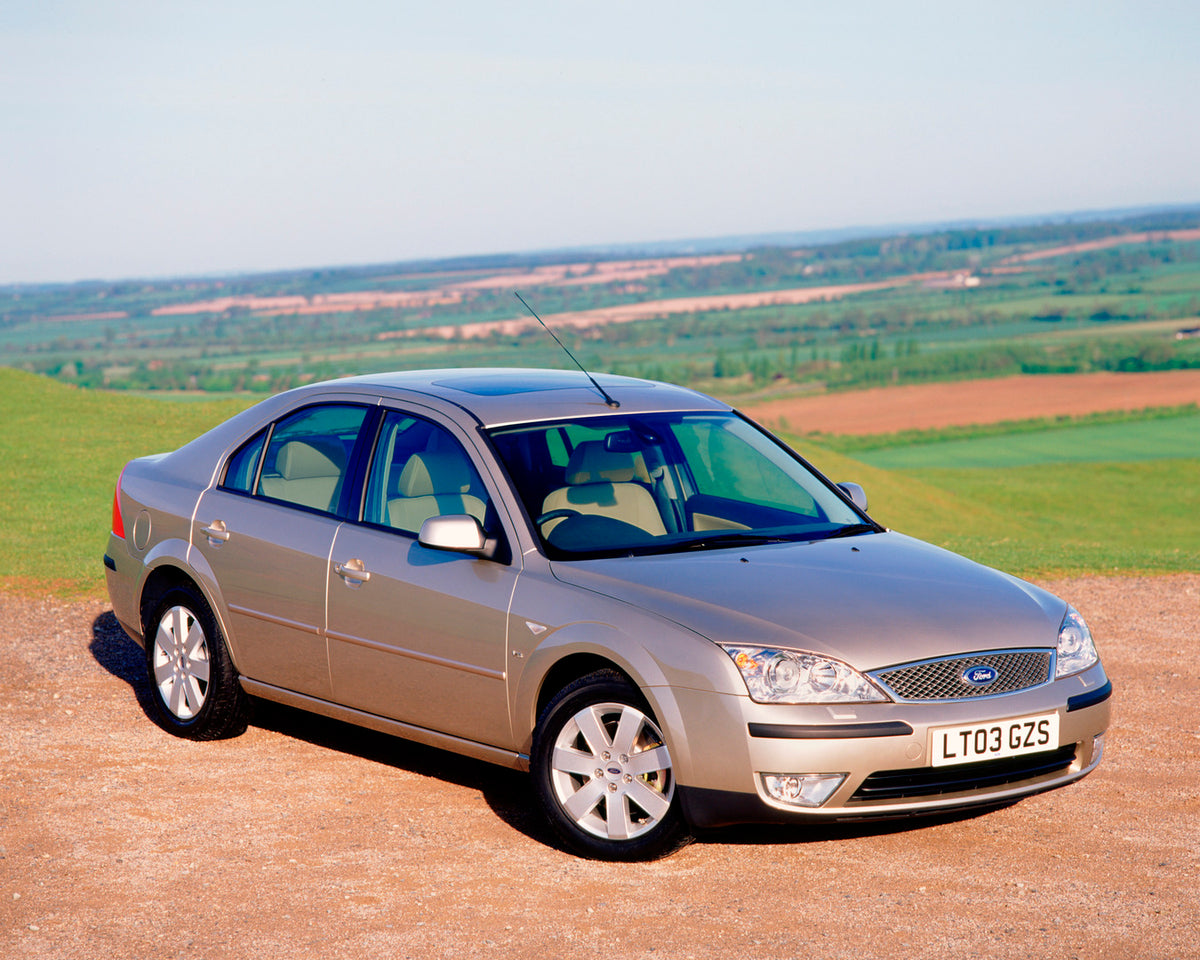 This archival image documents the 2003 Ford Mondeo Mark II with scenic farm landscape and is preserved in the Ford Heritage Vault as part of Ford Motor Company's historic photographic archive. Free for personal, non-commercial use. Ford Heritage V...
