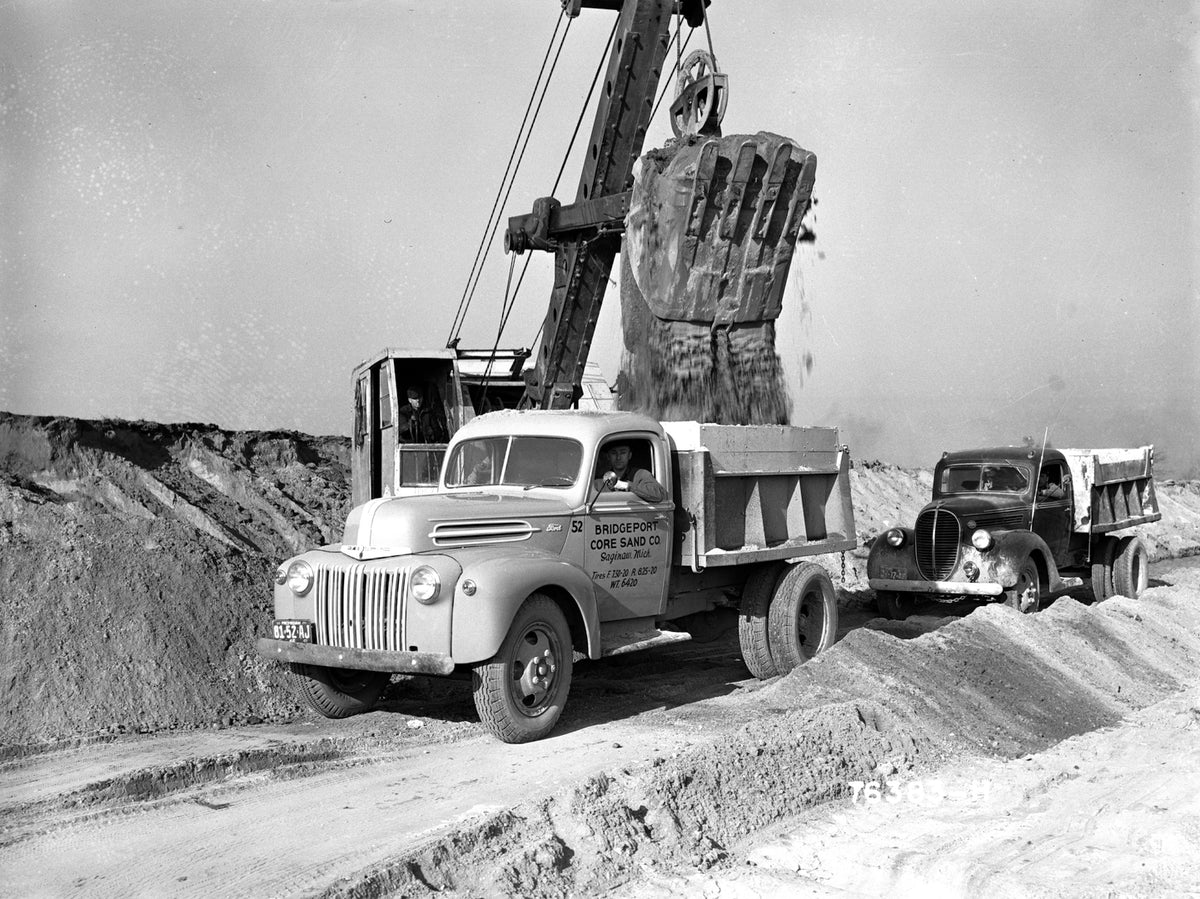 This archival image documents the 1942 Ford dump truck at construction site and is preserved in the Ford Heritage Vault as part of Ford Motor Company's historic photographic archive. Free for personal, non-commercial use. Ford Heritage Vault refer...