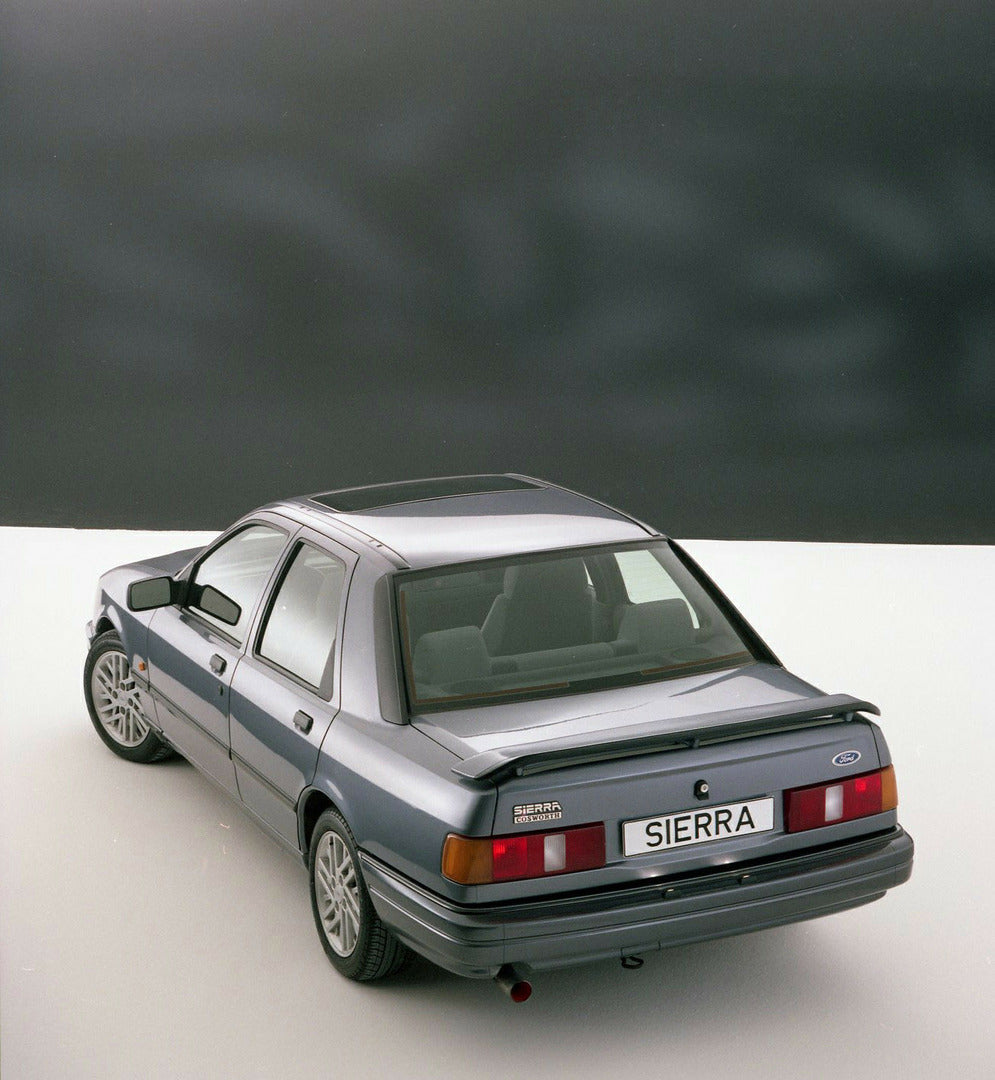 This archival image documents the 1987 Ford Sierra RS Cosworth Sapphire rear view in Kubiseh Studio and is preserved in the Ford Heritage Vault as part of Ford Motor Company's historic photographic archive. Free for personal, non-commercial use. F...