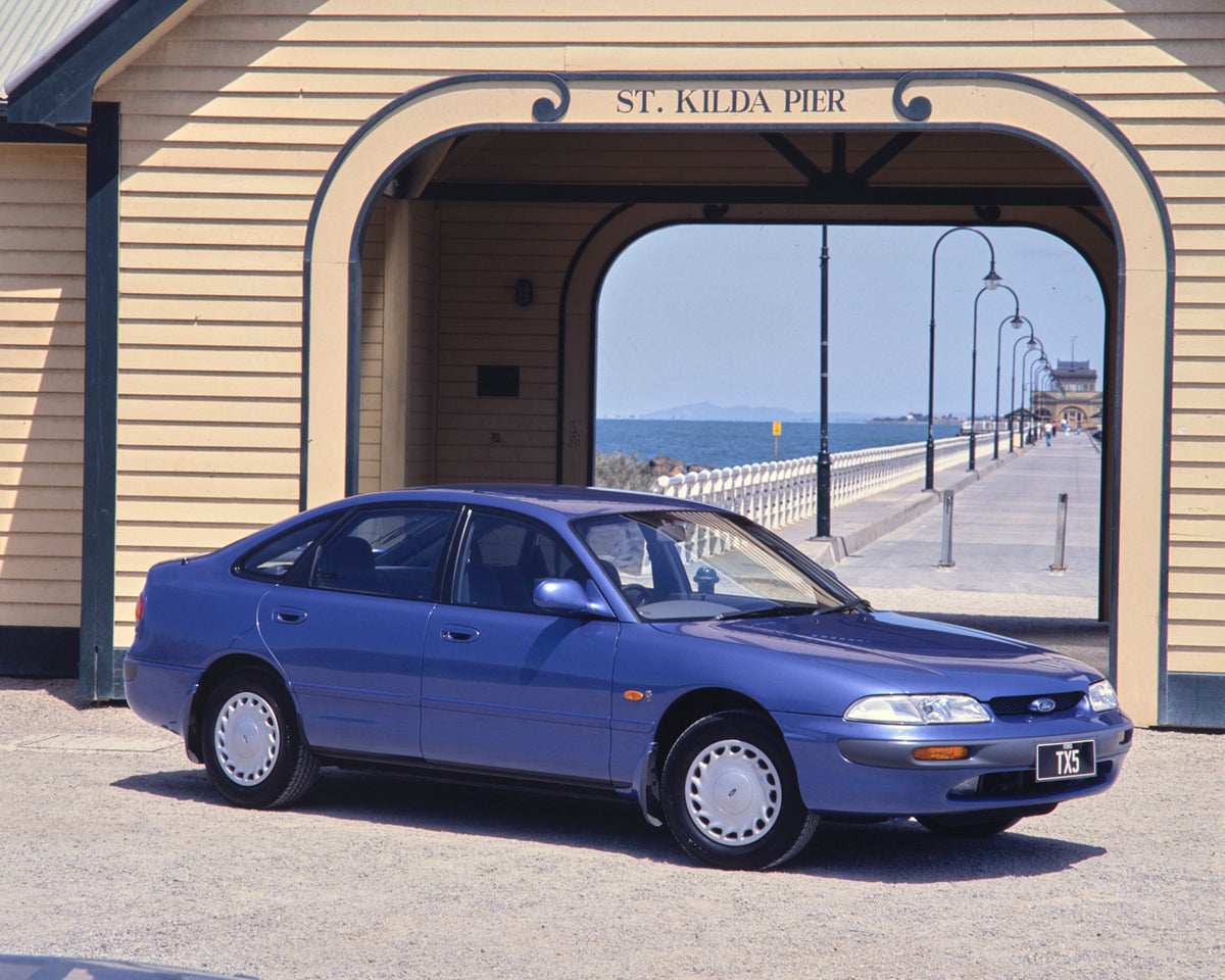 This archival image documents the 1995 Ford AY Telstar TX5 Sedan Driver Side Front End View by the Pier FAP-2011-3 and is preserved in the Ford Heritage Vault as part of Ford Motor Company's historic photographic archive. Free for personal, non-co...