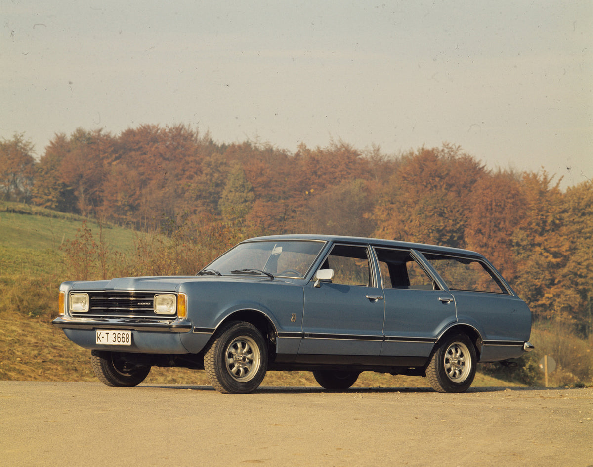 This archival image documents the 1975 Ford Taunus with scenic trees and is preserved in the Ford Heritage Vault as part of Ford Motor Company's historic photographic archive. Free for personal, non-commercial use. Ford Heritage Vault reference AR...