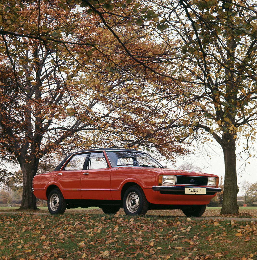 This archival image documents the 1975 Ford Taunus L low view on scenic road with trees and is preserved in the Ford Heritage Vault as part of Ford Motor Company's historic photographic archive. Free for personal, non-commercial use. Ford Heritage...