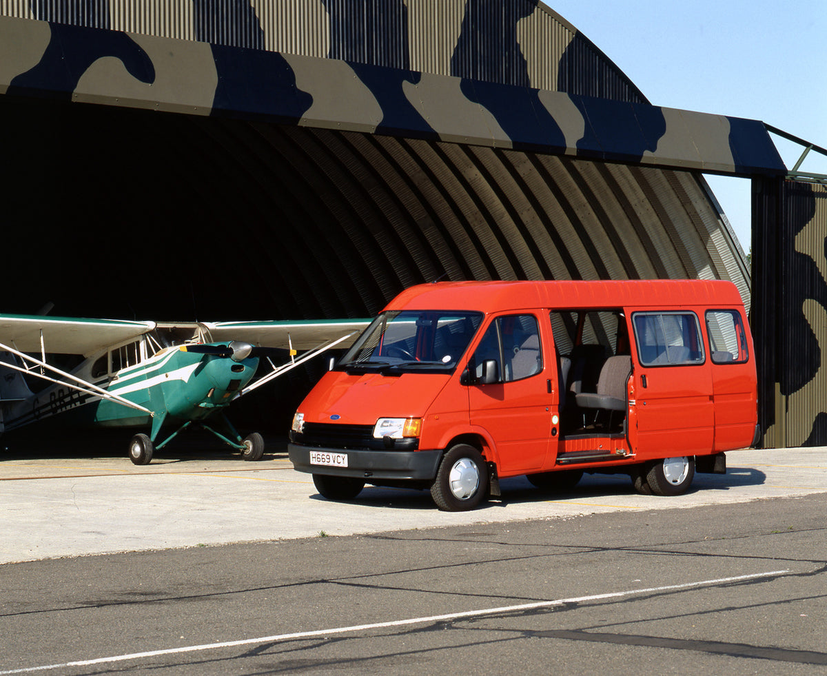 This archival image documents the 1990 Ford Transit Mark III Bus side view with open door and plane and is preserved in the Ford Heritage Vault as part of Ford Motor Company's historic photographic archive. Free for personal, non-commercial use. F...