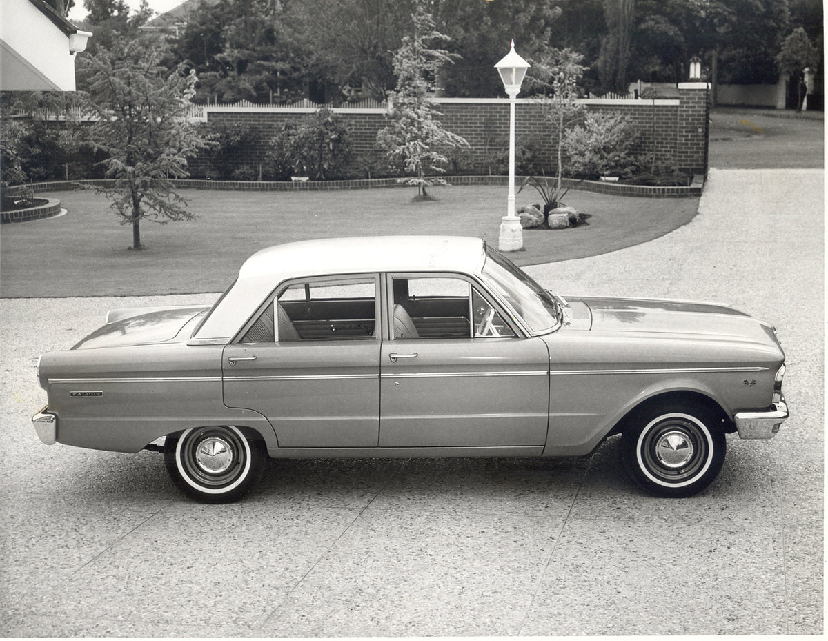 This archival image documents the 1965 Ford XP Falcon side view in scenic driveway and is preserved in the Ford Heritage Vault as part of Ford Motor Company's historic photographic archive. Free for personal, non-commercial use. Ford Heritage Vaul...
