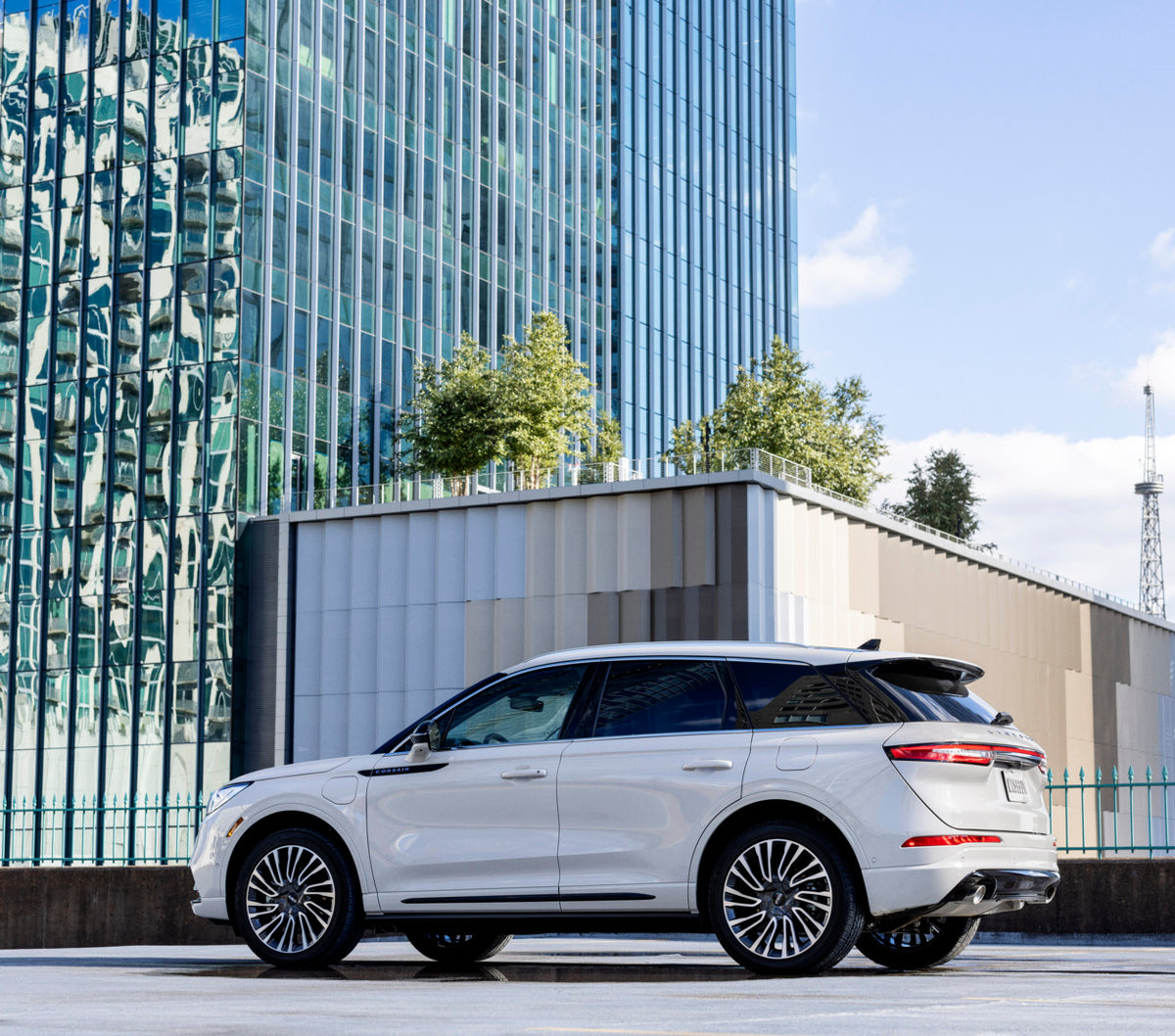 This archival image documents the 2021 Lincoln Corsair Grand Touring with scenic building and is preserved in the Ford Heritage Vault as part of Ford Motor Company's historic photographic archive. Free for personal, non-commercial use. Ford Herita...