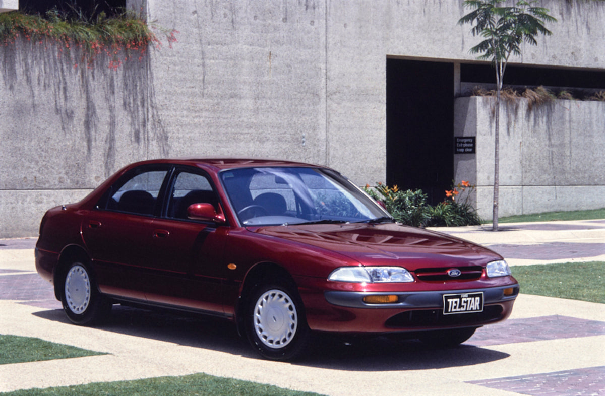 This archival image documents the 1993 Ford AX Telstar TX5 Ghia Sedan Driver Side Front End View in Courtyard FAP-2011-3 and is preserved in the Ford Heritage Vault as part of Ford Motor Company's historic photographic archive. Free for personal, ...