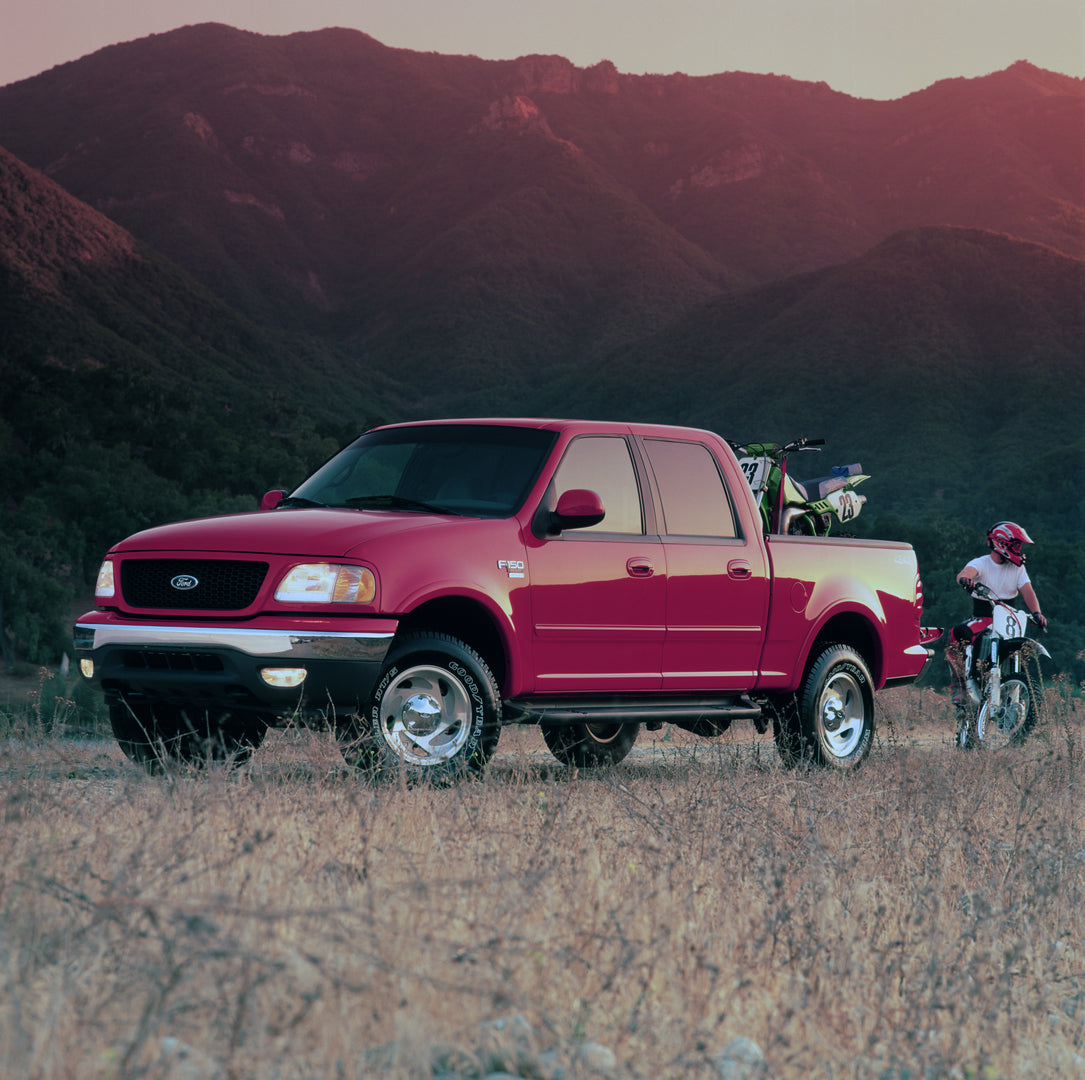 This archival image documents the 2001 Ford F-150 Super Crew pickup truck with dirtbikes and is preserved in the Ford Heritage Vault as part of Ford Motor Company's historic photographic archive. Free for personal, non-commercial use. Ford Heritag...