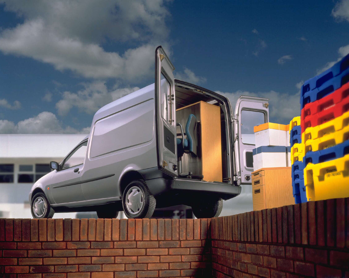 This archival image documents the 1996 Ford Fiesta Mark IV Courier 50 Van rear view with open doors and containers AR-2002-213709 and is preserved in the Ford Heritage Vault as part of Ford Motor Company's historic photographic archive. Free for p...