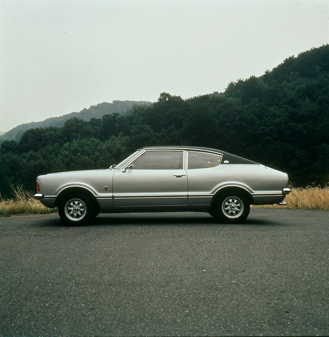 This archival image documents the 1974 Ford Taunus side view on scenic road with trees and is preserved in the Ford Heritage Vault as part of Ford Motor Company's historic photographic archive. Free for personal, non-commercial use. Ford Heritage ...