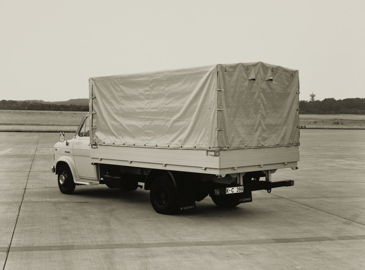 This archival image documents the 1970 Ford A-Series Truck rear view on pavement and is preserved in the Ford Heritage Vault as part of Ford Motor Company's historic photographic archive. Free for personal, non-commercial use. Ford Heritage Vault ...