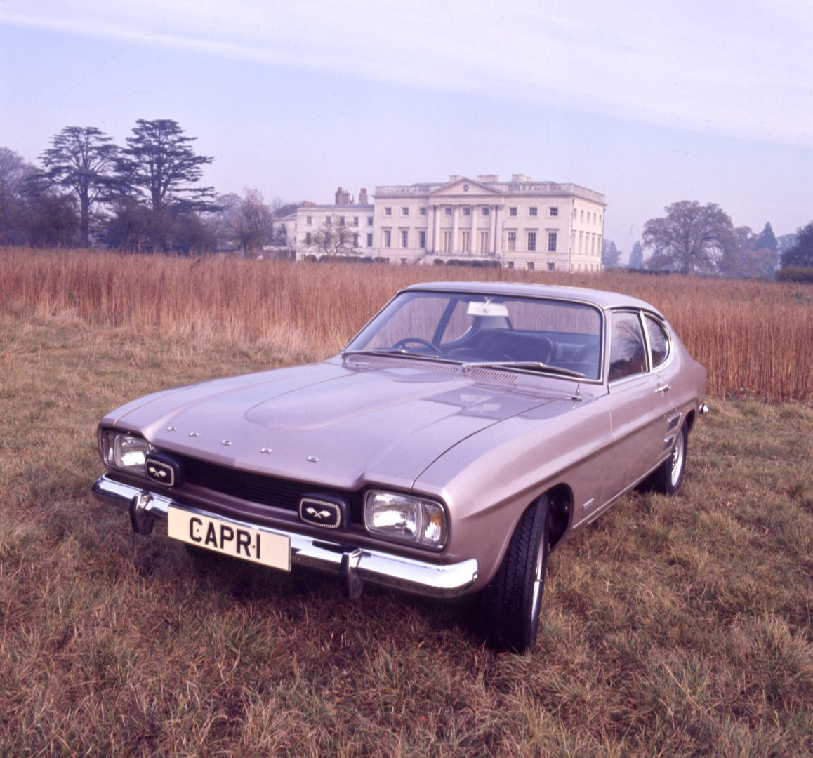This archival image documents the 1971 Ford Capri MK I 3000E in scenic field with mansion and is preserved in the Ford Heritage Vault as part of Ford Motor Company's historic photographic archive. Free for personal, non-commercial use. Ford Herita...