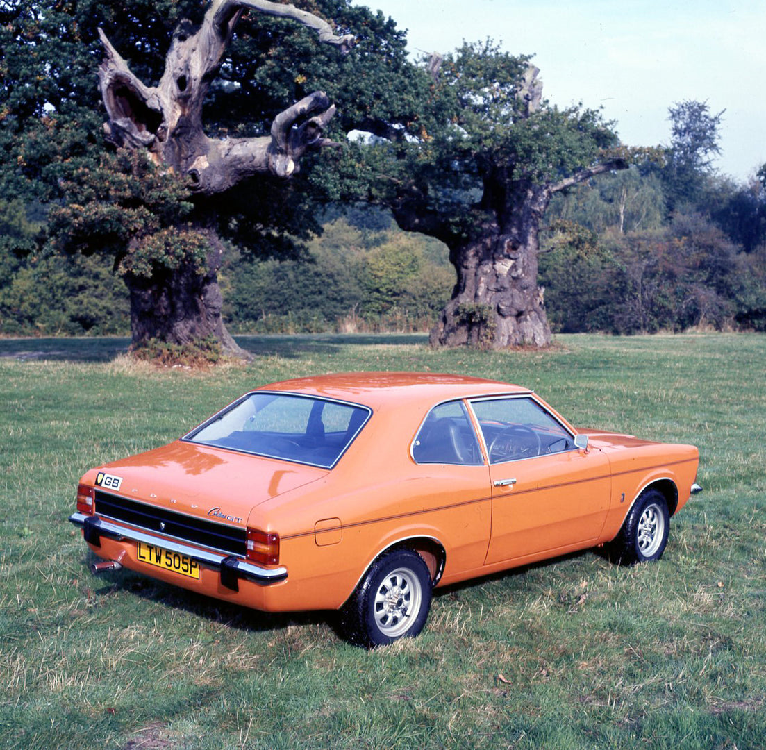 This archival image documents the 1975 Ford Cortina MK III GT 2.0 rear view in scenic field with trees and is preserved in the Ford Heritage Vault as part of Ford Motor Company's historic photographic archive. Free for personal, non-commercial use...