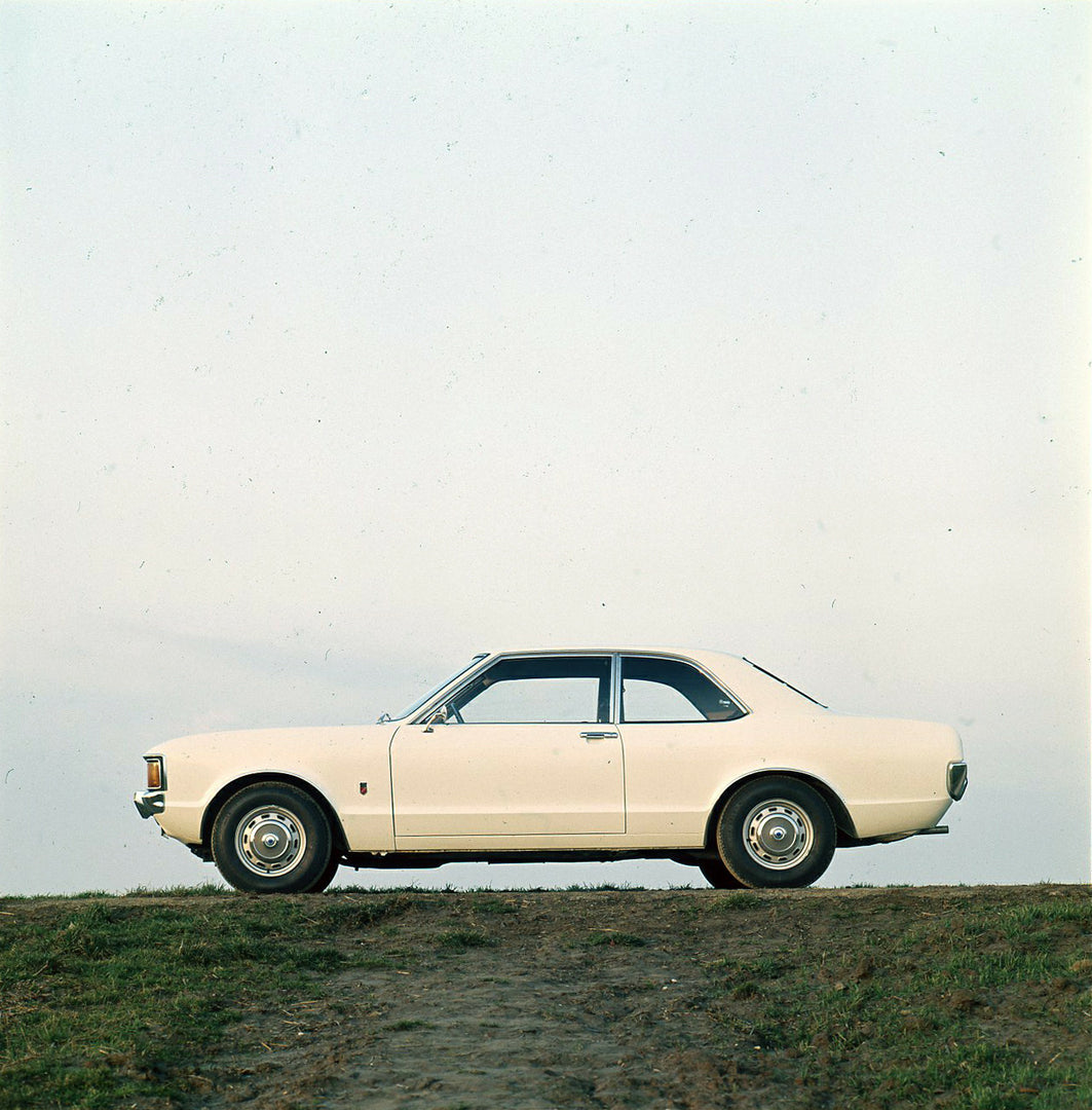 This archival image documents the 1973 Ford Consul side view on scenic hill and is preserved in the Ford Heritage Vault as part of Ford Motor Company's historic photographic archive. Free for personal, non-commercial use. Ford Heritage Vault refer...
