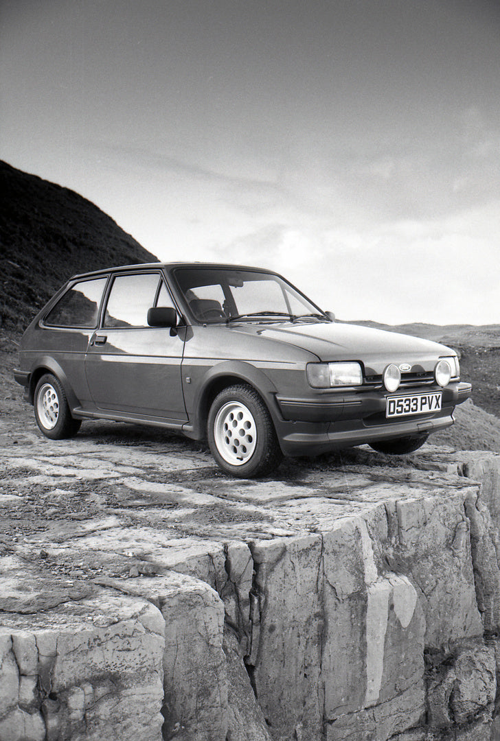 This archival image documents the 1987 Ford Fiesta Mark II XR2 on scenic rocky bluff and is preserved in the Ford Heritage Vault as part of Ford Motor Company's historic photographic archive. Free for personal, non-commercial use. Ford Heritage Va...
