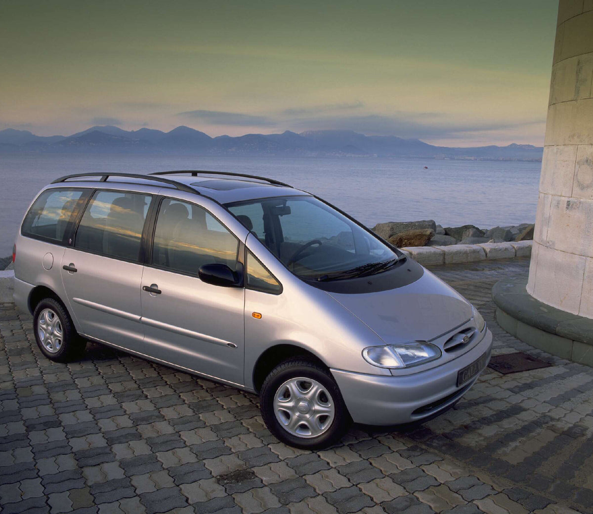 This archival image documents the 1994 Ford Galaxy Mark I Ghia overlooking scenic mountains AR-2002-213709 and is preserved in the Ford Heritage Vault as part of Ford Motor Company's historic photographic archive. Free for personal, non-commercial...