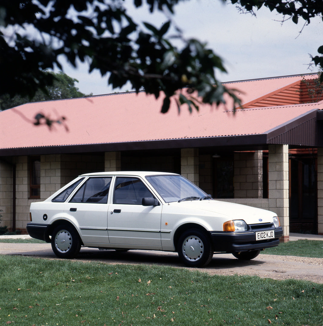 This archival image documents the 1987 Ford Escort Mark IV L in front of building and is preserved in the Ford Heritage Vault as part of Ford Motor Company's historic photographic archive. Free for personal, non-commercial use. Ford Heritage Vault...