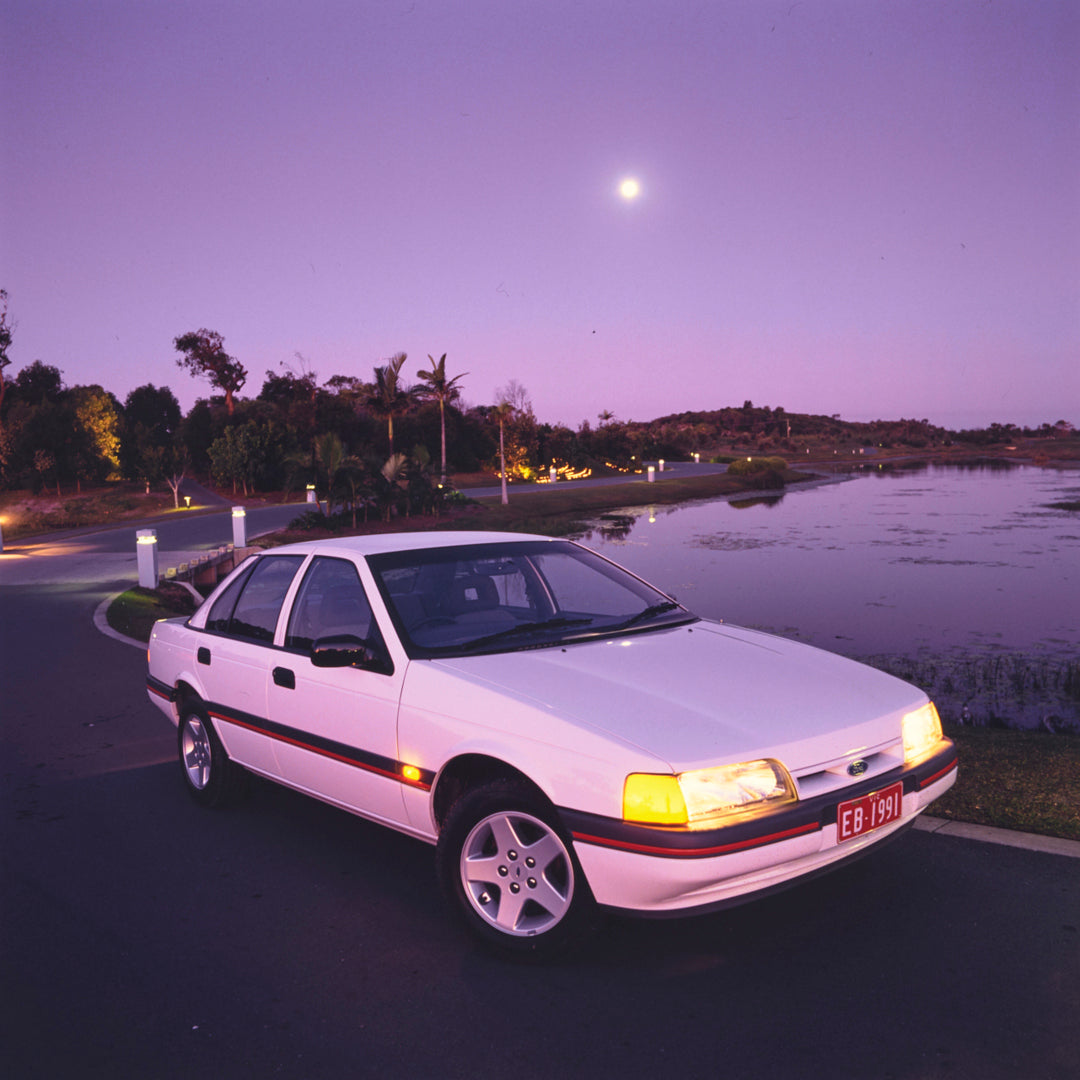 This archival image documents the 1991 Ford EB Falcon S Sedan Driver Side Front End View Parked Near Pond FAP-2011-3 and is preserved in the Ford Heritage Vault as part of Ford Motor Company's historic photographic archive. Free for personal, non-...
