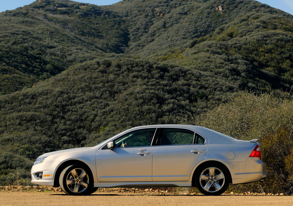 This archival image documents the 2010 Ford Fusion scenic mountains and is preserved in the Ford Heritage Vault as part of Ford Motor Company's historic photographic archive. Free for personal, non-commercial use. Ford Heritage Vault reference AR-...