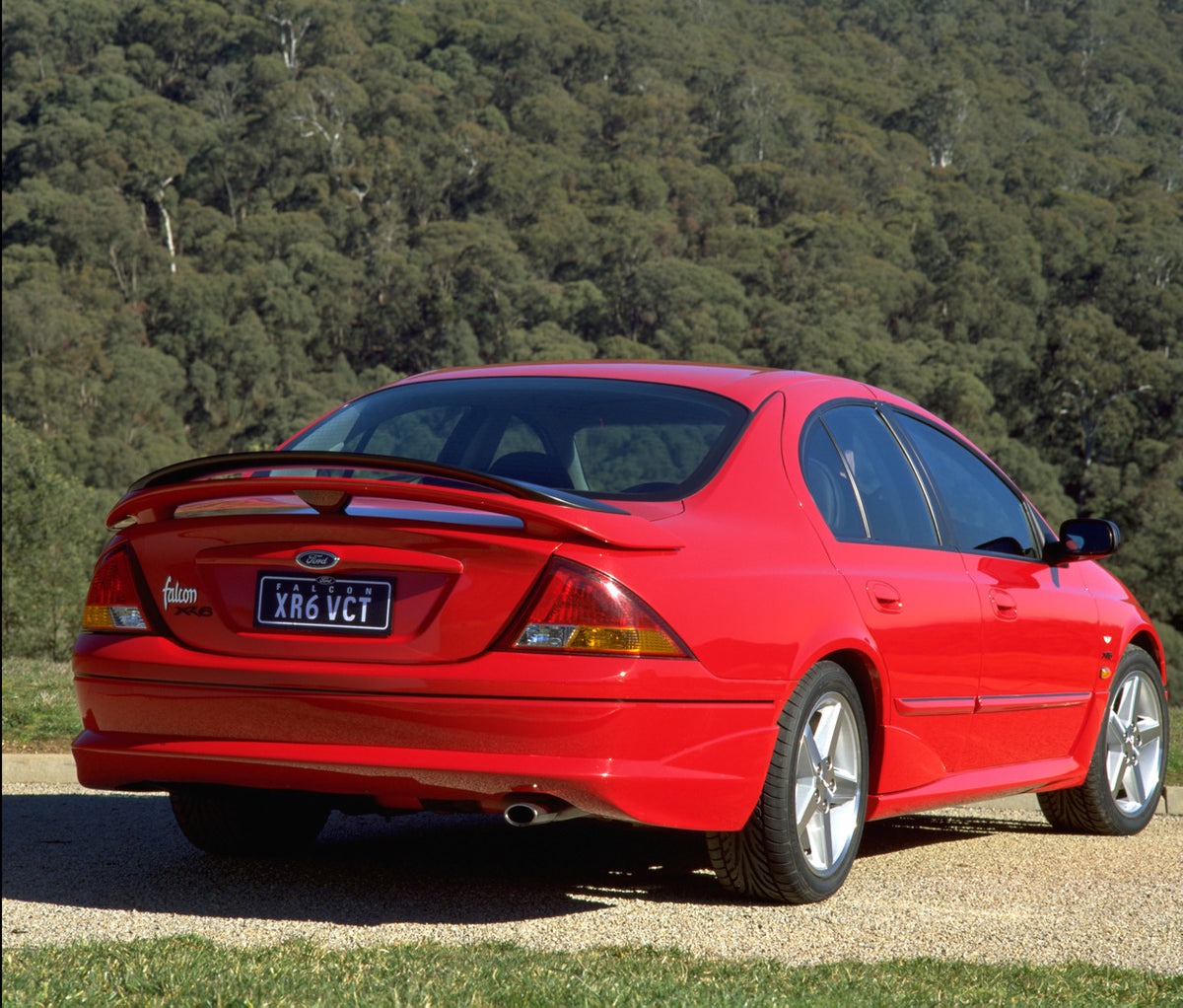 This archival image documents the 1998 Ford Falcon XR6 rear view with scenic trees and is preserved in the Ford Heritage Vault as part of Ford Motor Company's historic photographic archive. Free for personal, non-commercial use. Ford Heritage Vaul...