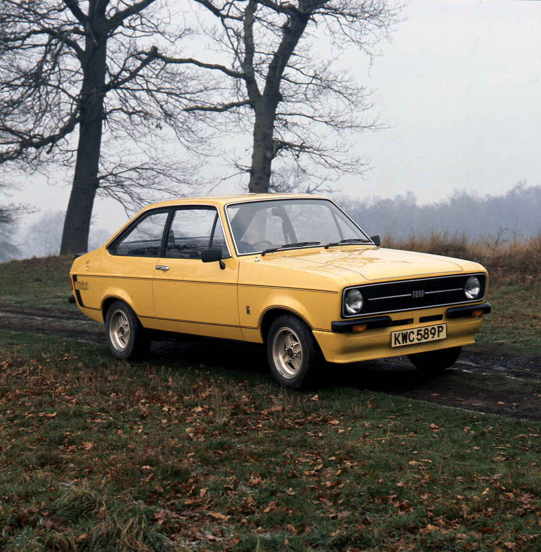 This archival image documents the 1975 Escort Mexico Mark II in scenic field and is preserved in the Ford Heritage Vault as part of Ford Motor Company's historic photographic archive. Free for personal, non-commercial use. Ford Heritage Vault refe...