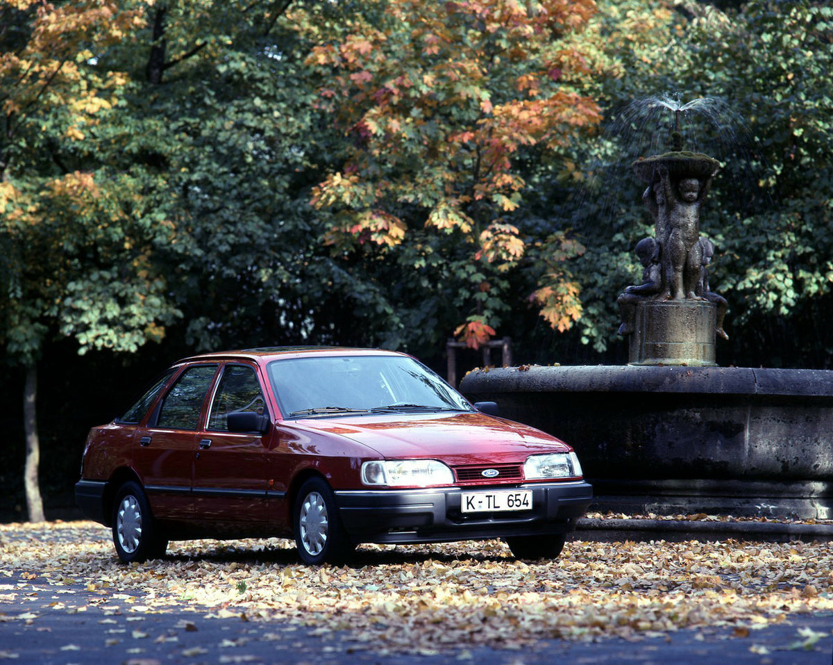 This archival image documents the 1989 Ford Sierra with scenic fountain and trees and is preserved in the Ford Heritage Vault as part of Ford Motor Company's historic photographic archive. Free for personal, non-commercial use. Ford Heritage Vault...