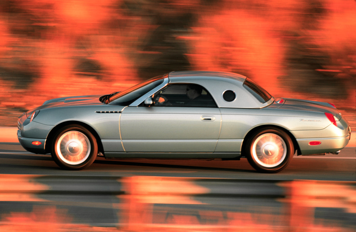 This archival image documents the 2002 Ford Thunderbird in motion and is preserved in the Ford Heritage Vault as part of Ford Motor Company's historic photographic archive. Free for personal, non-commercial use. Ford Heritage Vault reference AR-20...