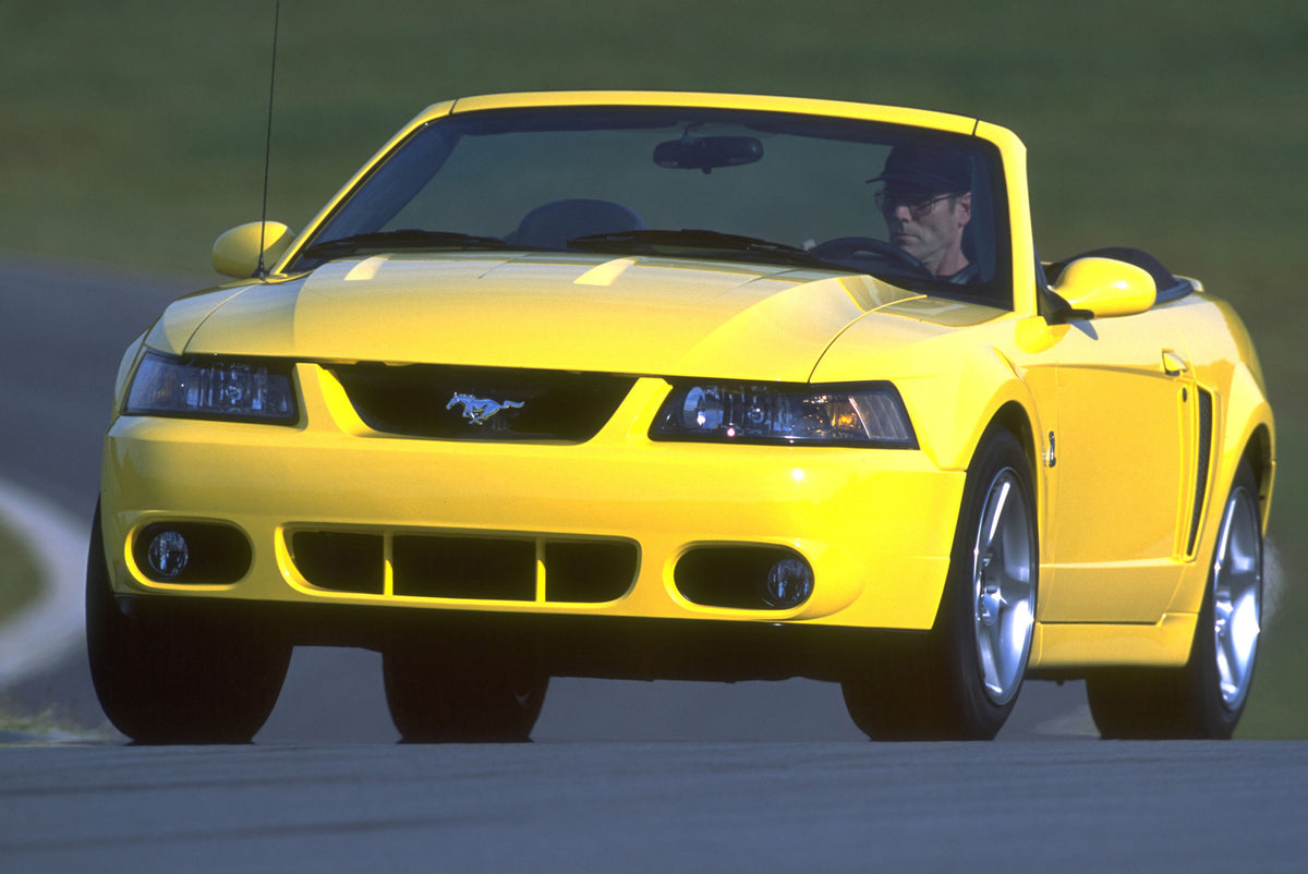 This archival image documents the 2003 Ford SVT Mustang Cobra convertible and is preserved in the Ford Heritage Vault as part of Ford Motor Company's historic photographic archive. Free for personal, non-commercial use. Ford Heritage Vault referen...